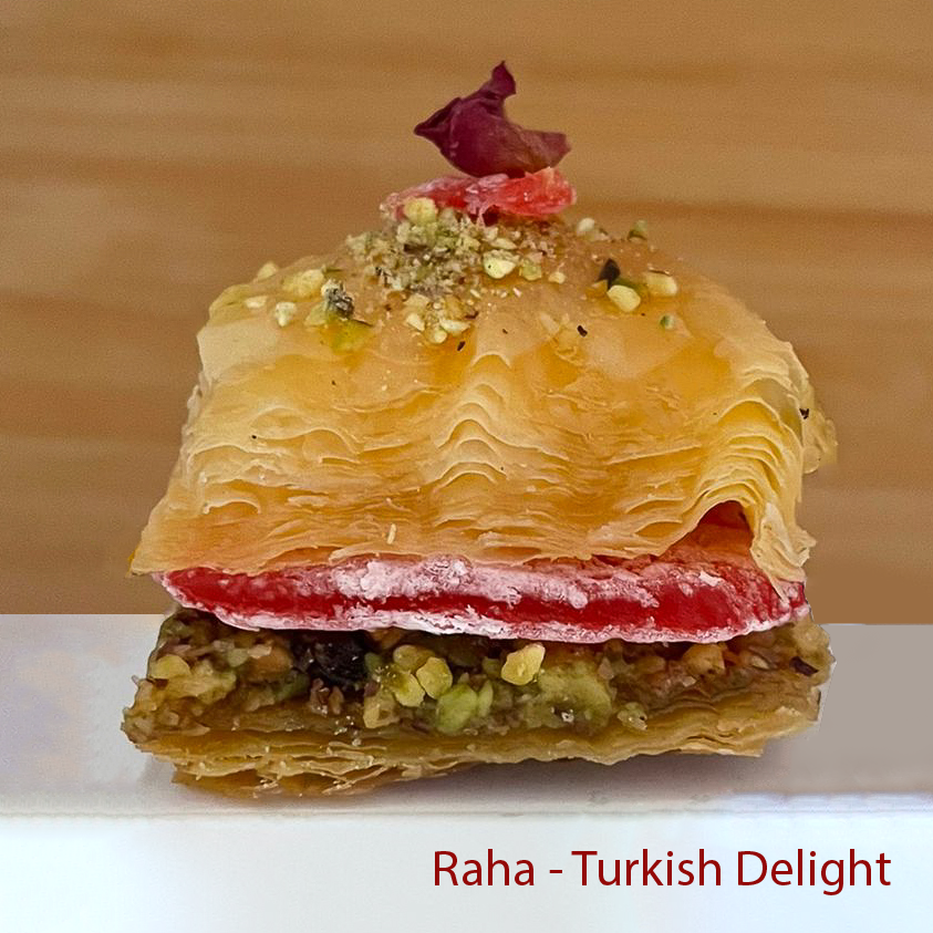 Turkish delight baklawa with layers and a rose on top, labeled 'Raha Turkish Delight'.